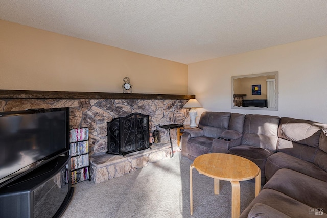 living room featuring a textured ceiling, carpet floors, and a fireplace