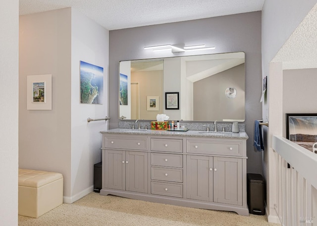 bathroom with vanity and a textured ceiling