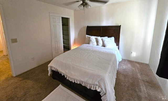 carpeted bedroom with a closet and ceiling fan