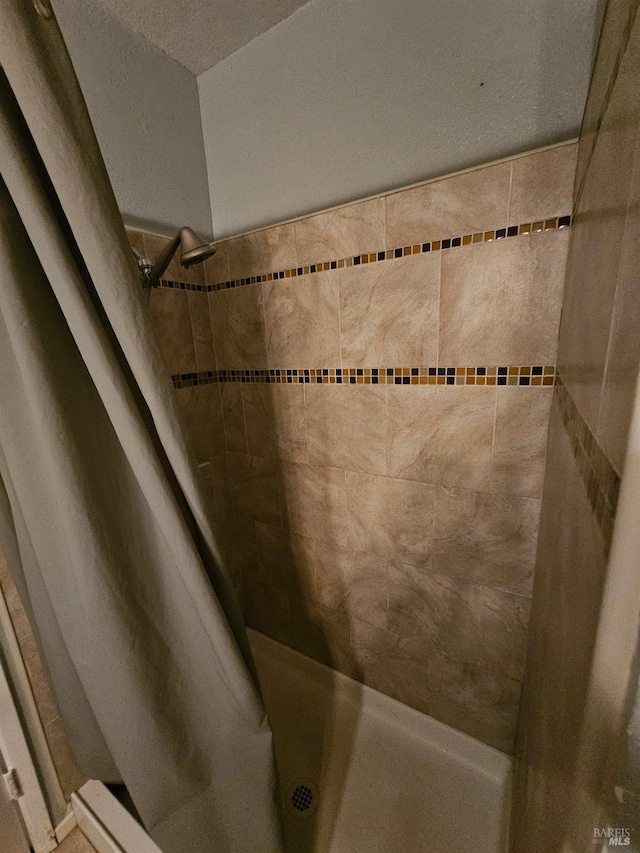 bathroom with a shower with shower curtain