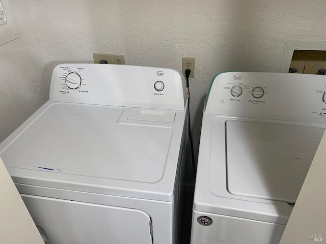 laundry room featuring washing machine and clothes dryer