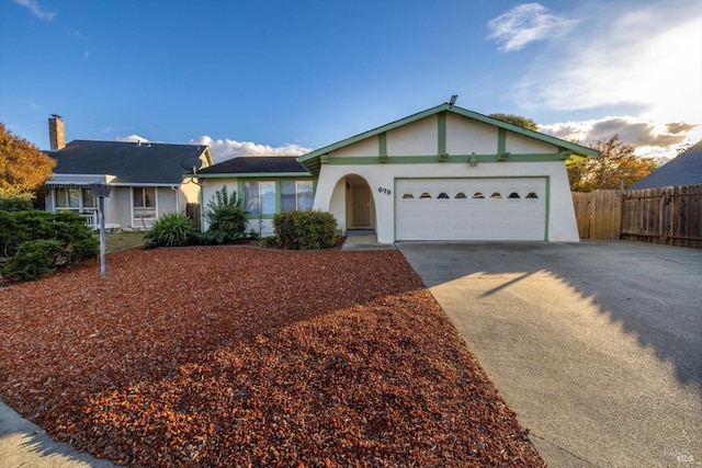 ranch-style home featuring a garage