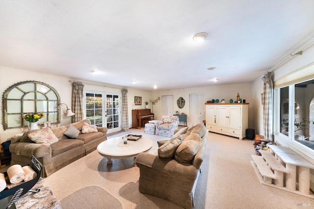 carpeted living room featuring french doors