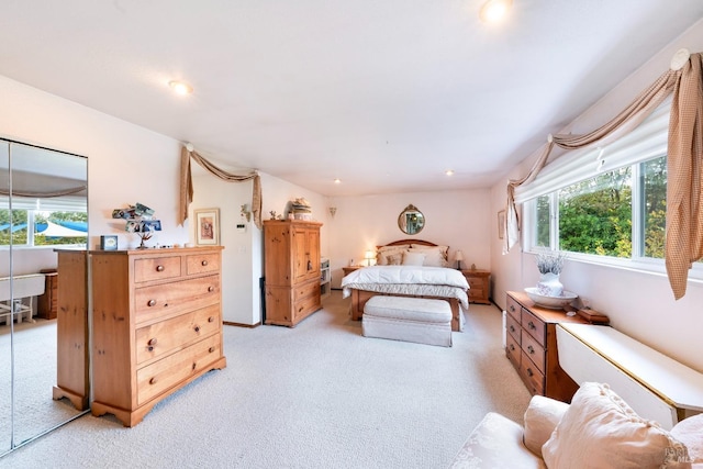 bedroom with recessed lighting and light carpet