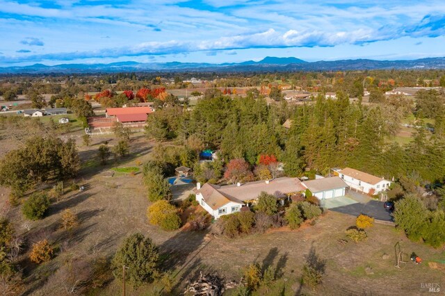 birds eye view of property featuring a mountain view