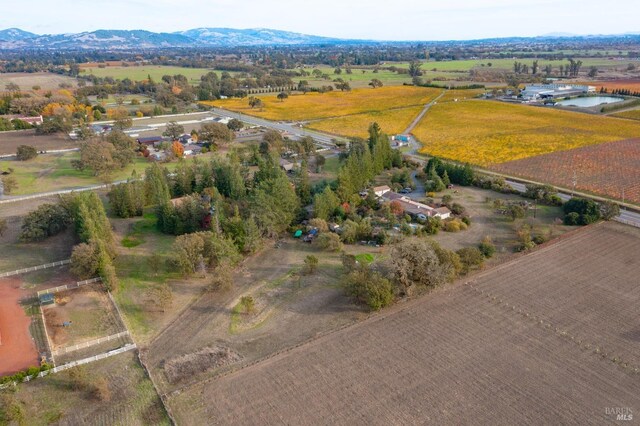 aerial view with a rural view and a water and mountain view