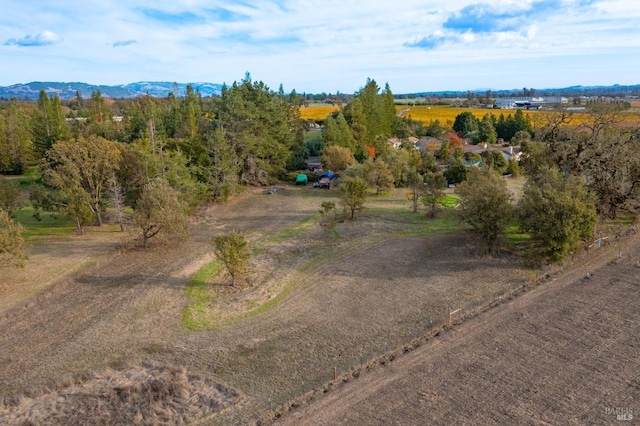 aerial view featuring a rural view and a mountain view