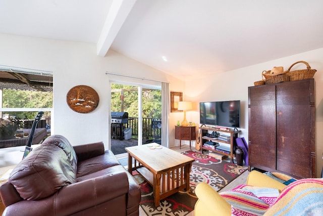 living room with vaulted ceiling with beams and hardwood / wood-style floors