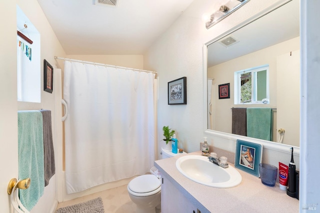 full bathroom featuring vanity, shower / tub combo with curtain, and toilet