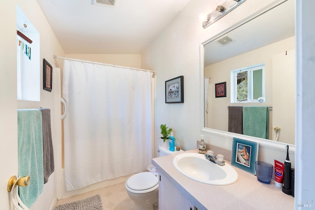 bathroom featuring toilet, visible vents, and vanity