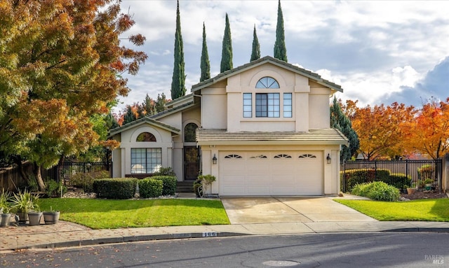 view of front property with a garage and a front lawn