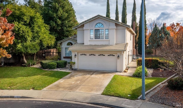 view of property with a front yard and a garage