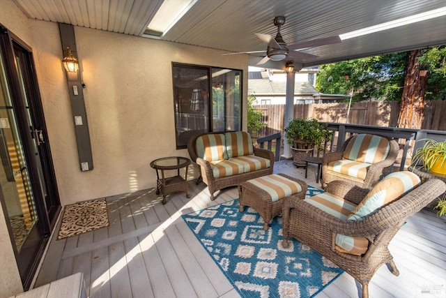 sunroom / solarium with ceiling fan