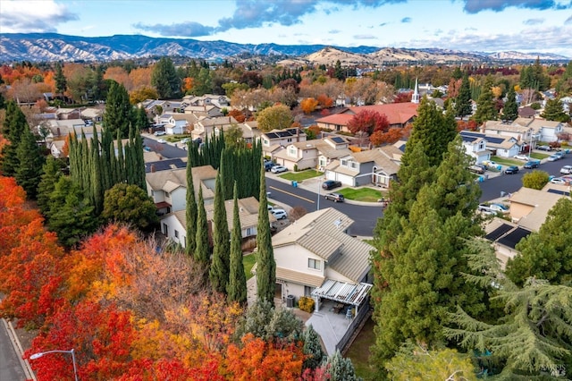 birds eye view of property featuring a mountain view