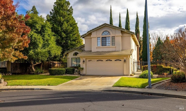 view of property with a garage and a front lawn