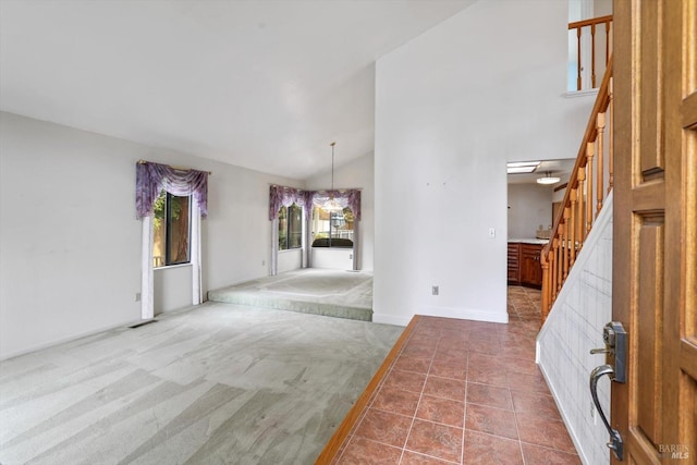 interior space with an inviting chandelier and vaulted ceiling