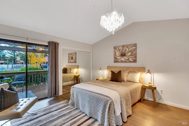 bedroom featuring baseboards, light wood-style flooring, vaulted ceiling, access to outside, and a notable chandelier
