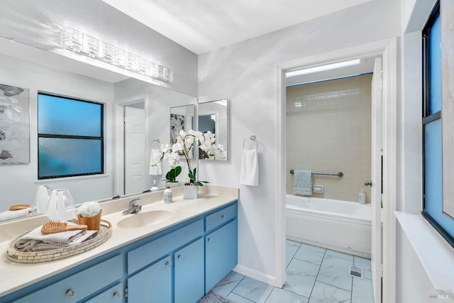 full bath with marble finish floor, vanity, and baseboards