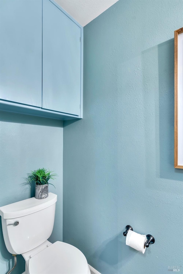 bathroom featuring toilet