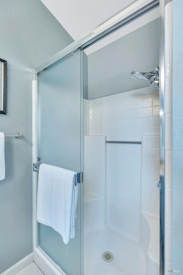 bathroom featuring a shower stall