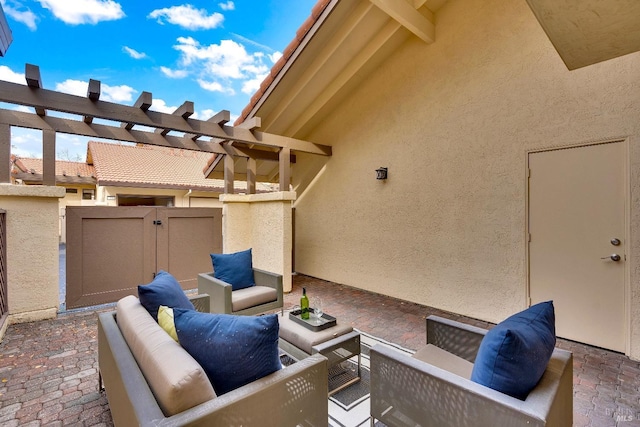 view of patio / terrace with an outdoor hangout area, fence, and a pergola