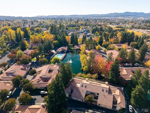 birds eye view of property with a mountain view and a residential view