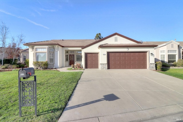 view of front facade with a front yard and a garage