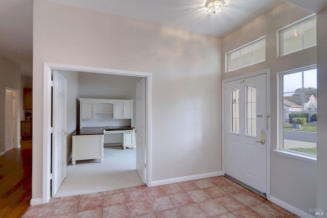 foyer with light tile patterned floors