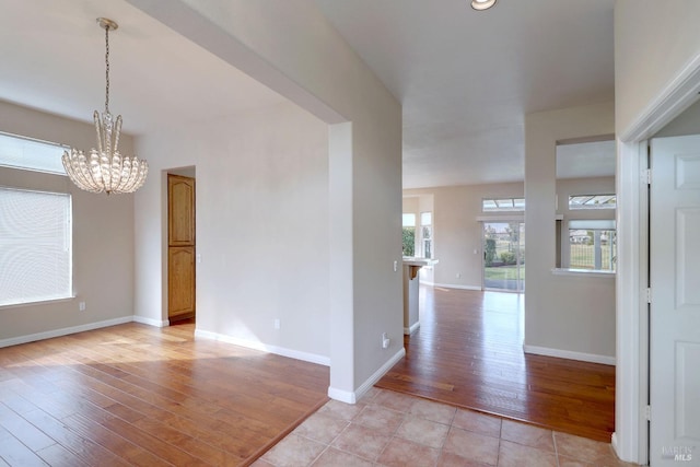 interior space featuring a chandelier and light hardwood / wood-style floors