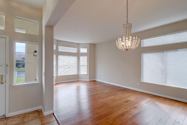 interior space with light hardwood / wood-style flooring and a chandelier