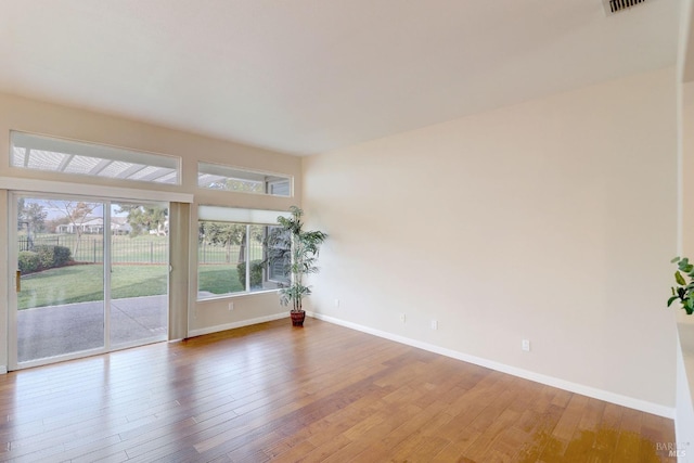 spare room featuring hardwood / wood-style floors