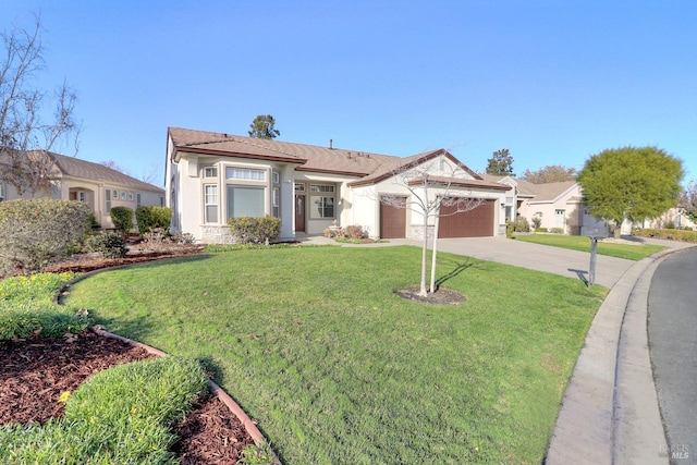 view of front of home with a front yard and a garage