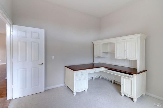 unfurnished office with light colored carpet