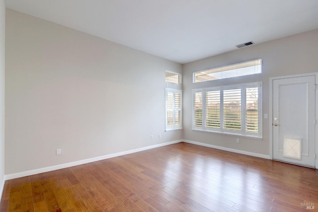 empty room with wood-type flooring