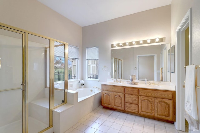 bathroom with vanity, tile patterned flooring, and plus walk in shower