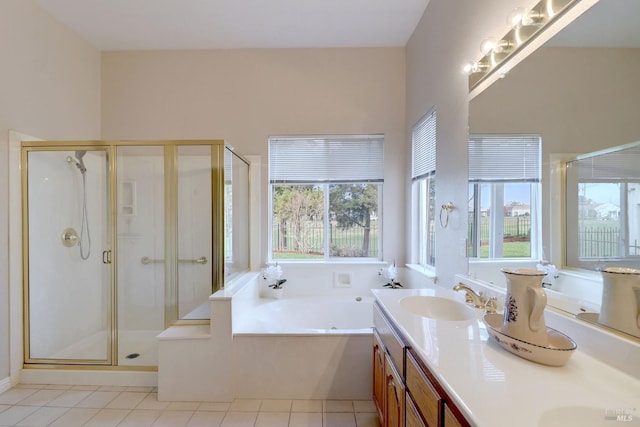 bathroom featuring tile patterned floors, vanity, and independent shower and bath