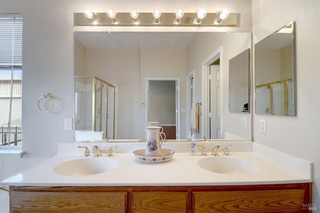 bathroom with vanity and an enclosed shower