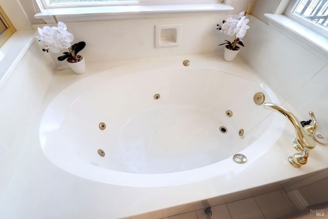 bathroom with tiled tub