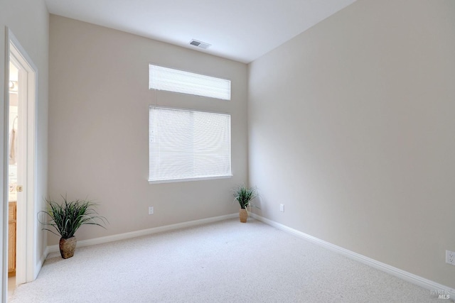 spare room with light carpet and a healthy amount of sunlight