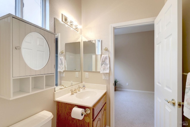 bathroom with vanity and toilet