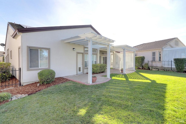 back of house featuring a pergola, a yard, and a patio