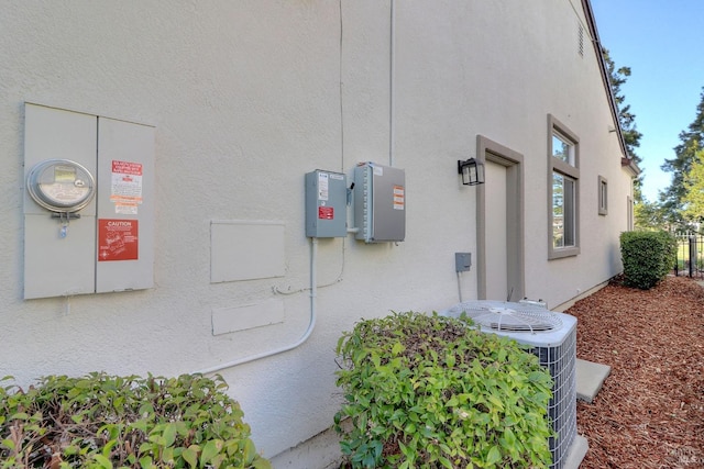 view of home's exterior with central AC unit