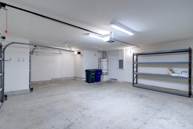 garage featuring electric panel, strapped water heater, and a garage door opener