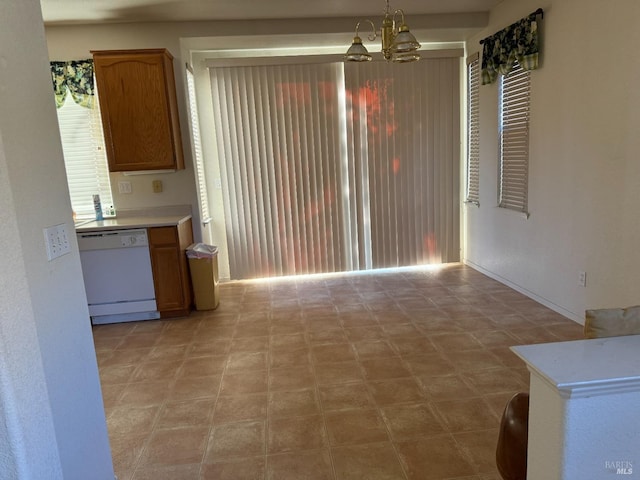 kitchen with dishwasher, hanging light fixtures, and a notable chandelier