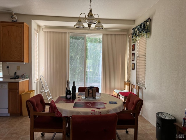 dining room with a notable chandelier