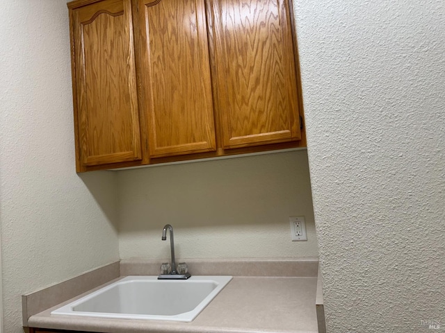 laundry area featuring sink