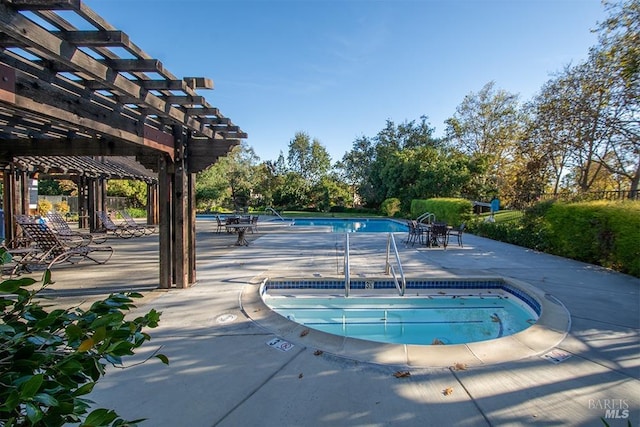 view of swimming pool with a pergola and a patio