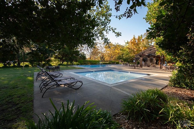 view of swimming pool with a gazebo, a lawn, and a patio