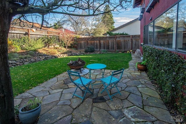 view of patio with a fire pit