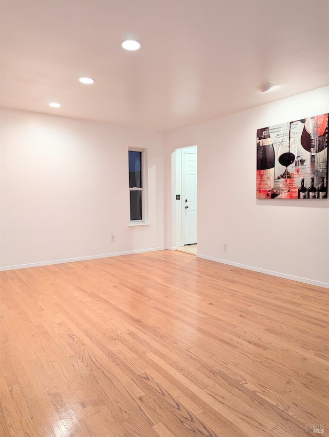 spare room with light hardwood / wood-style floors